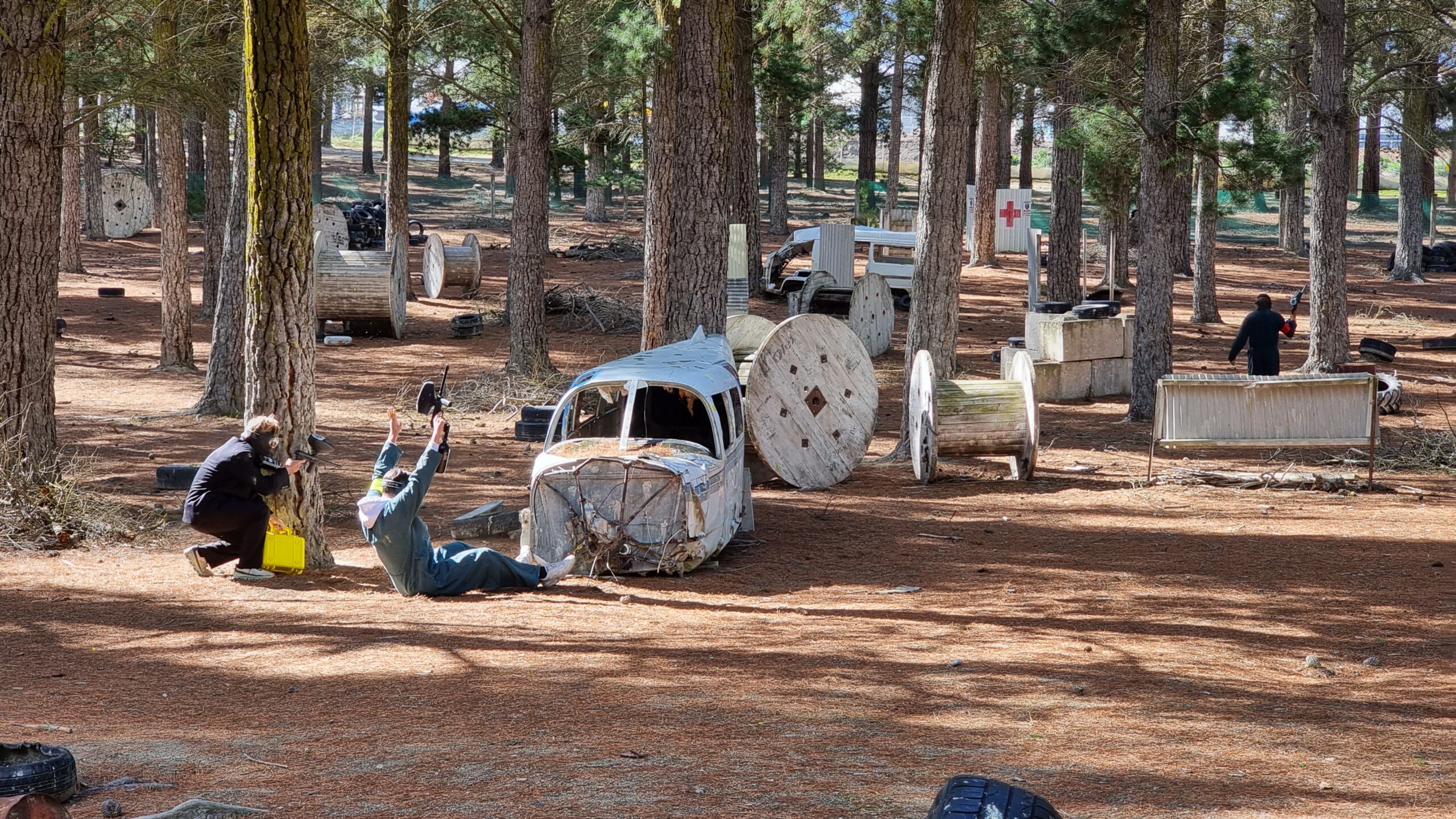 Paintball player surrendering next to crashed aircraft